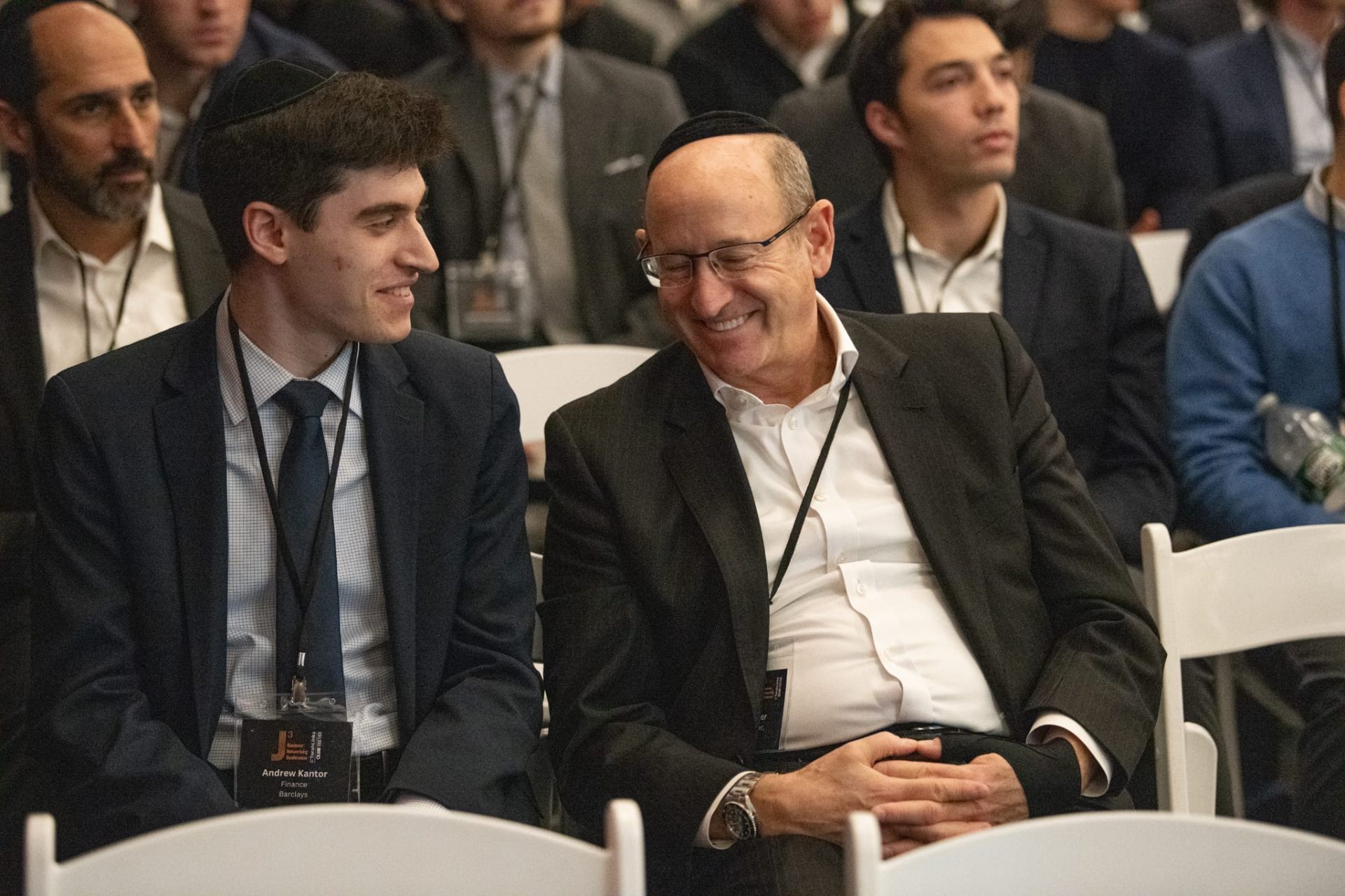 Student and mentor sharing a laugh in the J³ 2026 audience