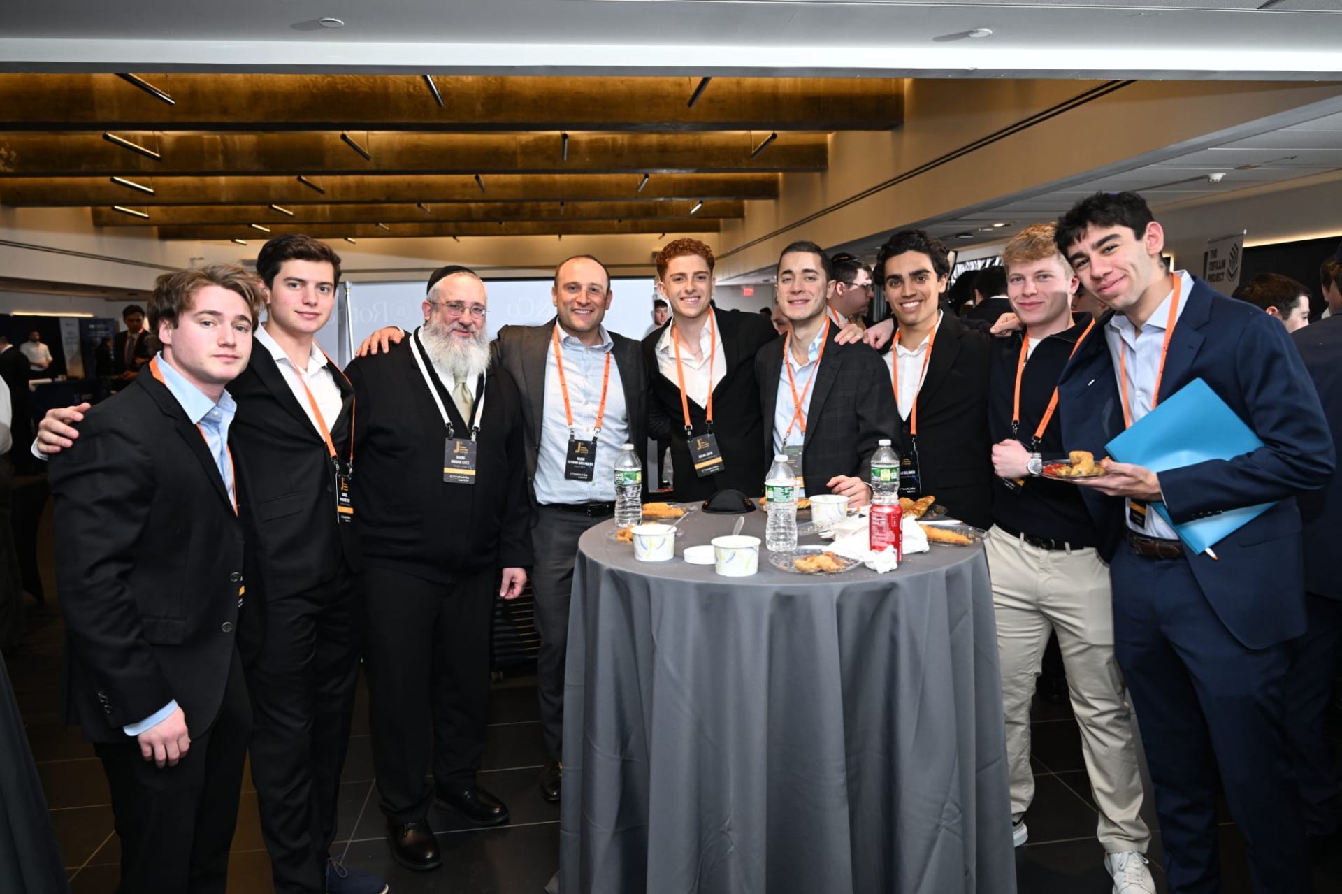 A rabbi with a circle of young Jewish men