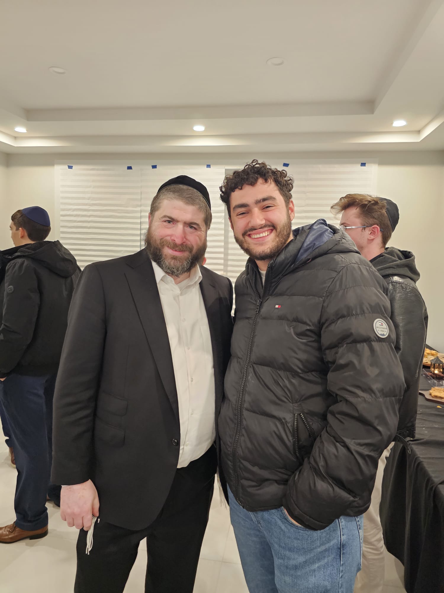 A rabbi and a student smiling together at J³ 2025