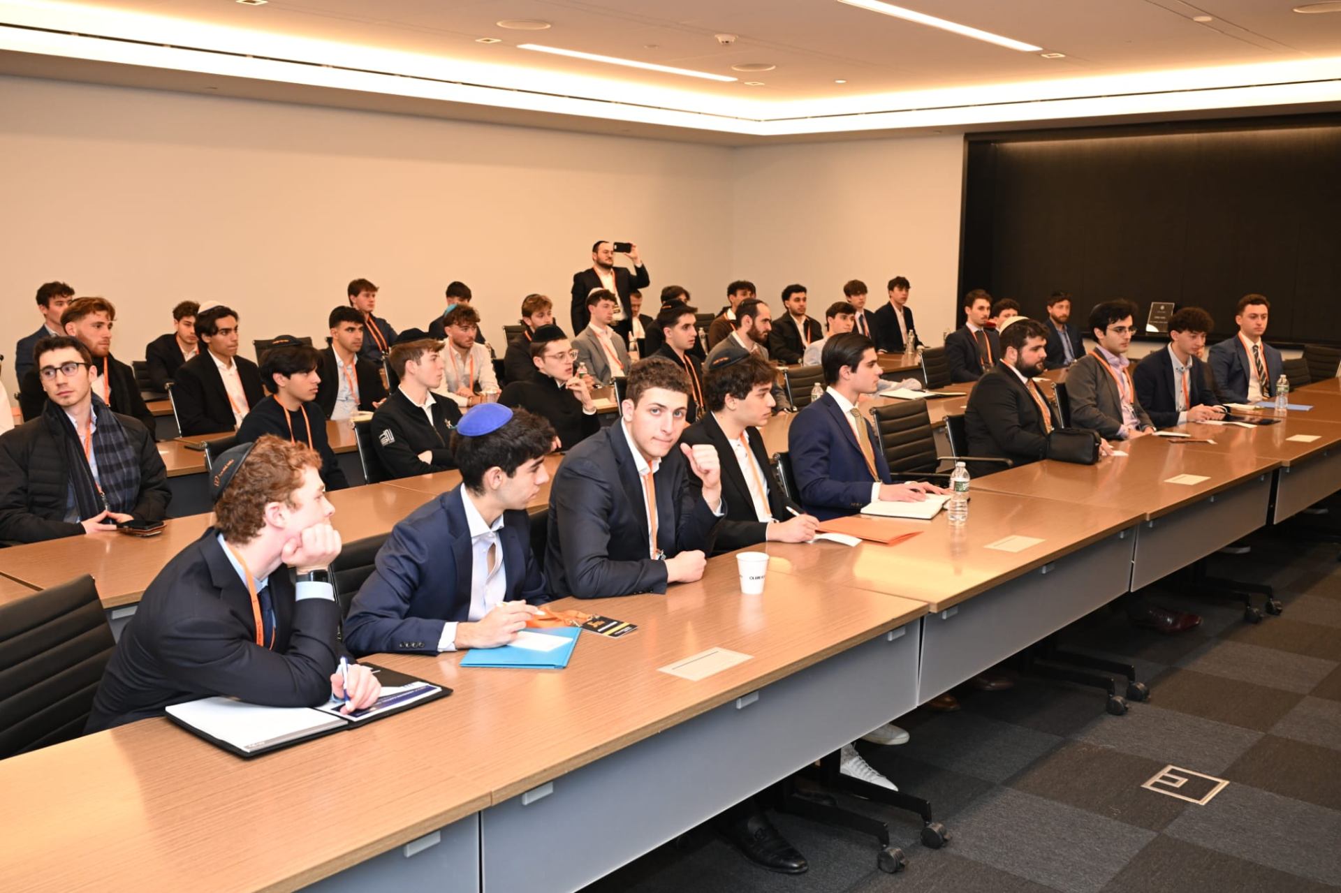 Young Jewish men learning Torah together in a classroom